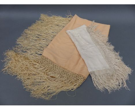 Two silk fringed squares, one ivory and one peach