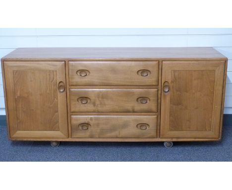 Retro Ercol light elm sideboard the three central drawers with sliding cutlery tray, flanked by two cupboards, W156 x D45 x H