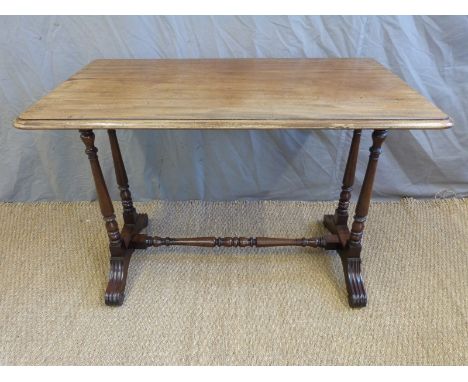 A 19thC mahogany sofa table raised on four turned supports united by a tapered stretcher, W101 x D59 x H71cm 