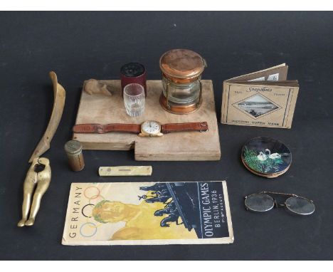A collection of items including Mouseman style cheese board, Felea watch, 1936 Berlin Olympic Games programme and novelty min
