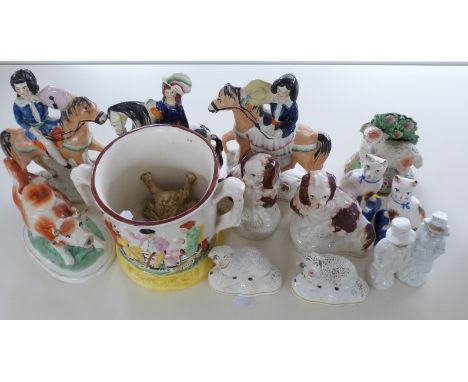 A collection of Staffordshire figures including early 19thC, lamb, frog mug, cow creamer etc
