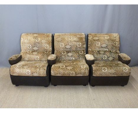 Three retro armchairs, the arms of which can be removed in order to form a sofa, maximum width 210cm