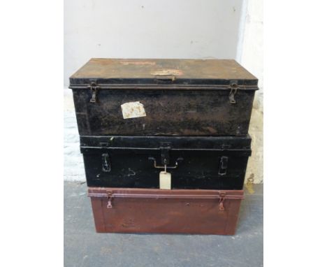 Three vintage metal steamer or travelling trunks, some with shipping line labels, width approximately 93cm