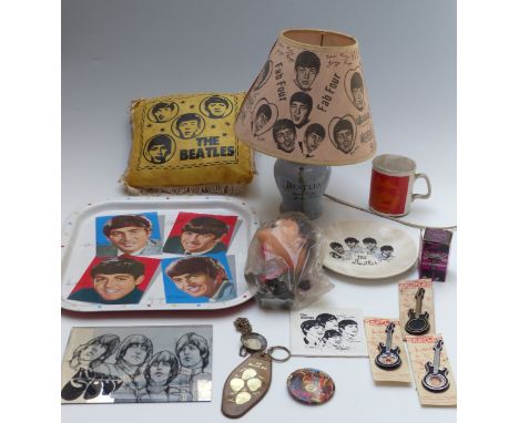 The Beatles collectibles to include cushion, mirror, table lamp with shade, badges, Beatles soft toy by Rosebud etc