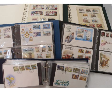 Four albums of Isle of Man stamps 1973-2000 and an album of first day covers