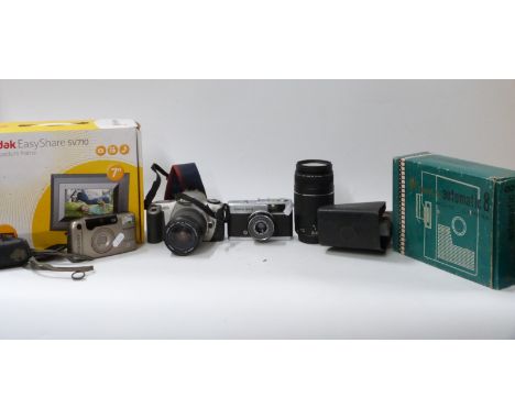 A collection of vintage cameras and home movie equipment to include Olympus Trip 35, Canon EOS 300 and lens, Canon EF 75-300m