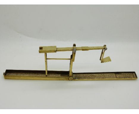 A. Wilkinson, Ormskirk, near Liverpool, brass cased fold out guinea scale with instructions to interior of case