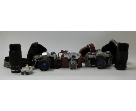 Olympus OM10 with Tamron 1:3.5-4.5 28-50mm lens, Canon AE1 with 50mm 1:1.8 lens, Tokina 80-200mm 1:4 and Canon 70-150mm 1:4.5