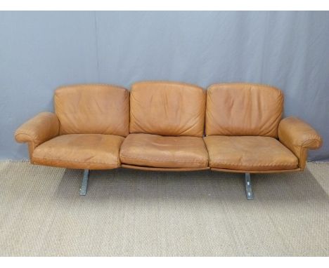 Retro leather sofa, probably 1970's Italian, with leather 'stitched' decoration, raised on twin steel quad bases, length 220c