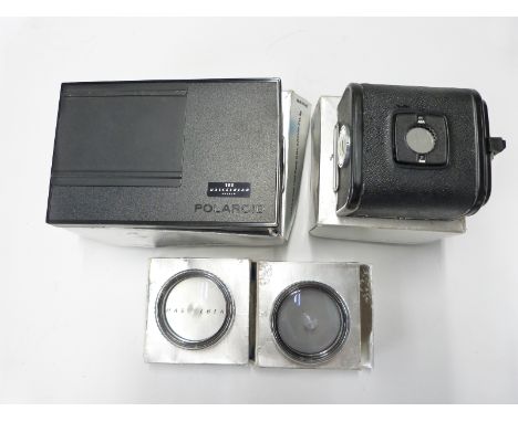 Hasselblad A12 film back 30147 number UE 3145129 together with a Polaroid film magazine 30198 and Proxor 0.5/50 50296 and 1.0