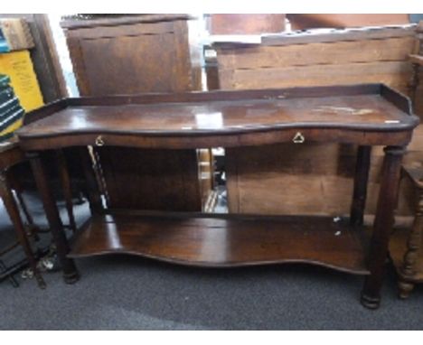 A 19thC mahogany serpentine fronted side table with two drawers and shelf below raided on tapering octagonal legs, W150 x D44