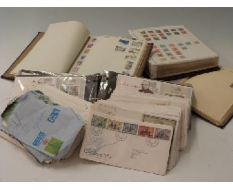 Three albums of Commonwealth and foreign stamps and a quantity of first day covers, loose and in an album