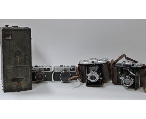 Quantity of cameras to include Sands Hunter large box camera, Zeiss Ikon folding camera, Olympus 35RC and a wooden tripod 