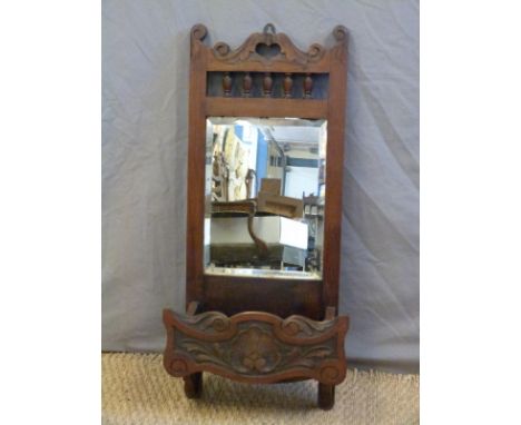 Late 19th/early 20thC wall mirror with bevelled edge and shelf below, H76cm