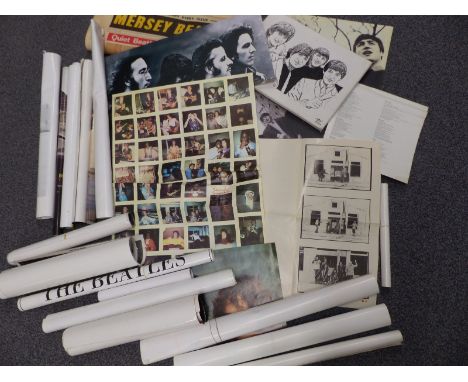 A collection of Beatles posters including a set of Merseybeat front page artwork, Italian Yellow Submarine poster artwork and