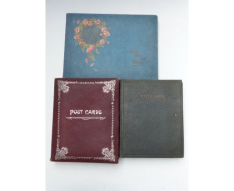 Three postcard albums Edwardian and later, the first album entirely European buildings and other topographical cards (190 plu