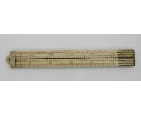 A 19thC/early 20thC ivory four section folding 24 inch ruler  