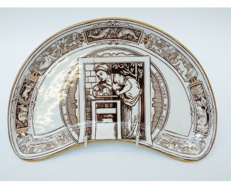 Wedgwood demi-lune dish in the manner of Walter Crane decorated in the Arts & Crafts style with central female figure working