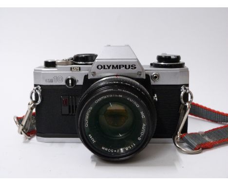 Olympus OM10 SLR camera with f=50mm 1:1,8 lens 