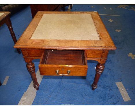 A light oak games table with dished recess for counters, frieze drawer, standing on turned legs, 33'' square x 28'' high.