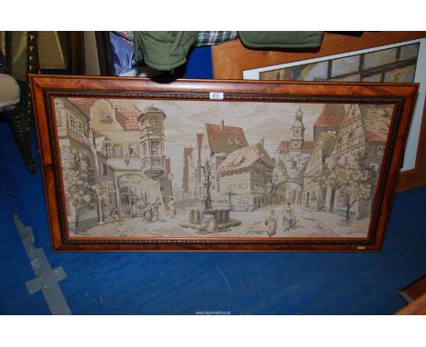 A framed machined tapestry of a town scene, 43'' x 23'' high.