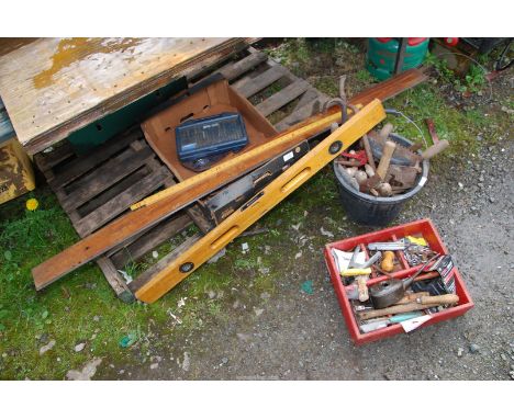 A spirit level, large and small Allen keys, measuring tools, a bucket of trowels, etc.,