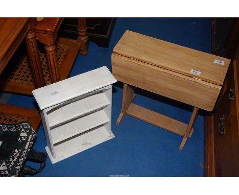 A small drop leaf table and a small display shelf unit.