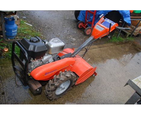 A Husqvarna four-stroke petrol engined Rotavator with 5.5 h.p. overhead valve Briggs & Stratton engine.  Engine started easil