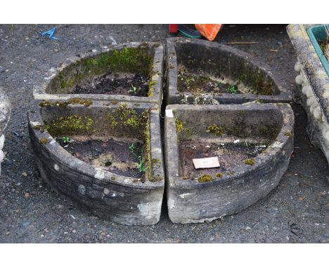 A four sectioned circular planter 32" diameter x 6" deep.