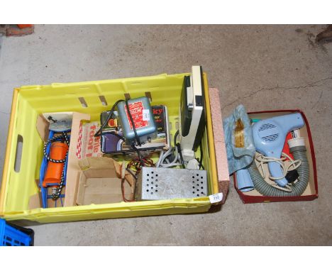 A vintage hair dryer, foot pump, battery charger (6 and 12 volt) etc.