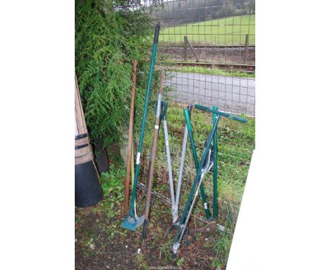 A quantity of garden tools including long arm edging shears, a garden claw, a shooting stick and two rakes.