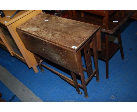 A small Oak arts and crafts dropleaf Table with art nouveau floral fretwork detail to ends, for restoration.