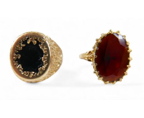 Two 9ct gold rings, comprising a gold and garnet ladies dress ring, the garnet approximately 18 by 13mm, size Q, together wit