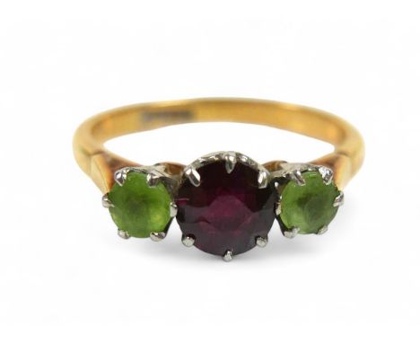 An 18ct yellow gold three stone ring, size N, weight 3.2g.