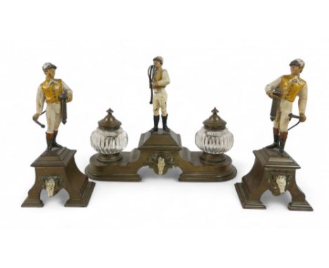 A Victorian brass and cold painted figural three piece desk inkwell set, mounted with jockey figures painted in white and yel