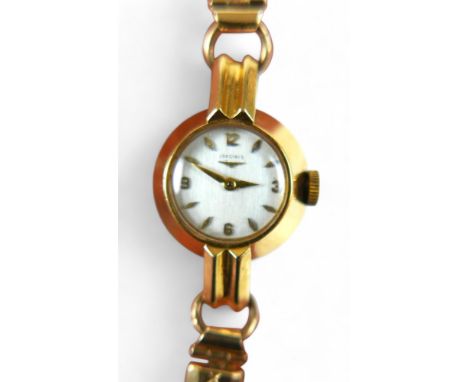 An 18ct yellow gold ladies Longines watch, manual wind, 18mm case on a gold plated sprung strap, total weight 19.7g, running.