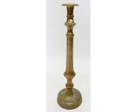 A large brass candlestick, 61.5cm high 