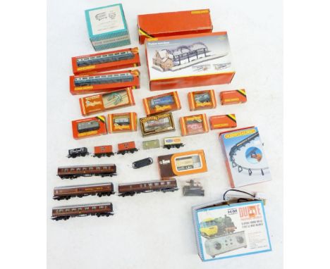 A large quantity of Hornby 'OO' gauge wagons, coaches etc. plus station terminus, mostly boxed plus some Lima 