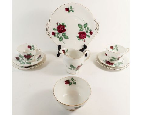 A Royal Standard 'Red Velvet' tea service comprising six cups and saucers, six side plates, cake plate, sugar and milk jug 