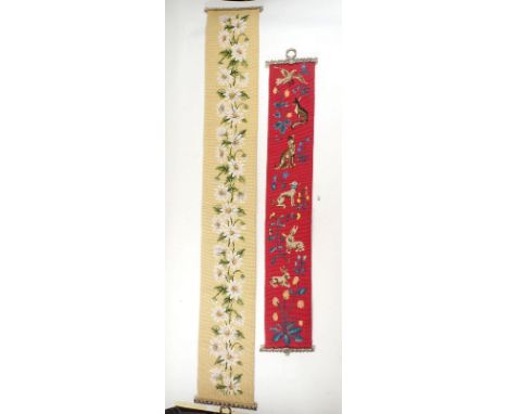 Two floral tapestry bell pull style wall hangings 