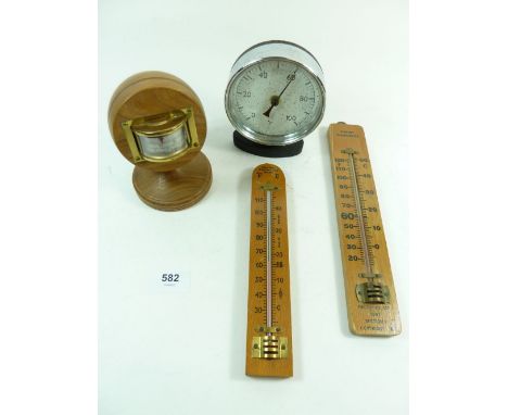 A chrome framed thermometer and three others 
