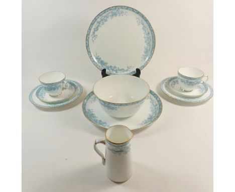 A Grainger's Worcester tea service with blue floral decoration comprising twelve cups and saucers, twelve tea plates, two cak