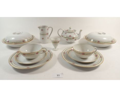 A Bauscher Bros tea service with rose printed borders comprising a teapot, milk, sugar, two egg cups, two muffin dishes, eigh