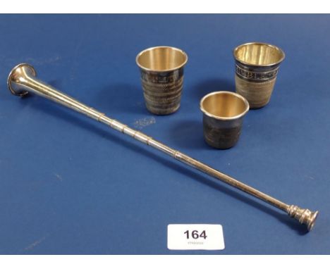 Three silver-plated 'Just a Thimble Full' measures and a silver-plated miniature hunting horn