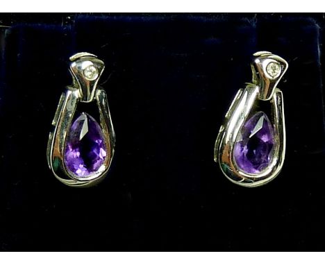 A pair of 9ct white gold earrings each set with a pear cut amethyst and small diamond, approx 1.4cm length, total weight 2.5g