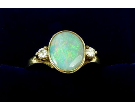 A 9 carat gold opal and chip diamond ring, size O-P, 3.1g 