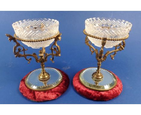 A pair of gilt metal and mirrored fairy light holders, with glass holders impressed 'Fairy Pyramid, S Clarke'