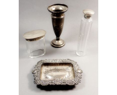 A silver vase 15.5cm tall, a silver embossed card tray 59g and two silver mounted dressing table bottles 