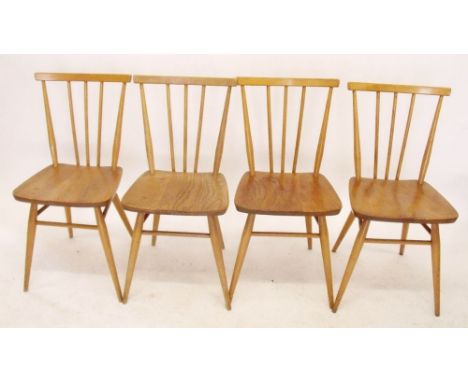 A set of four lightwood Ercol stick back chairs 