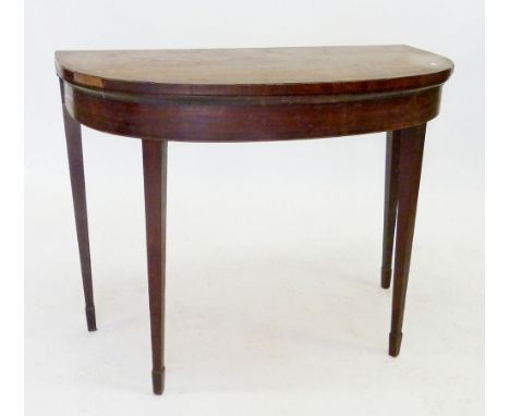 A Georgian mahogany fold top demi lune card table on square tapered support, 130 x 65cm 